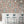 Liquid Lab wallpaper by Brand McKenzie in dusky pink, pattern detail of bottles and laboratory glassware