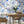 The Mediterranean wallpaper by Brand McKenzie in blue and white, a whitewashed hillside village in a dining area