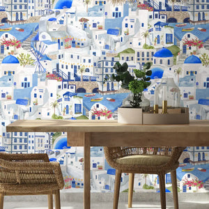 The Mediterranean wallpaper by Brand McKenzie in blue and white, a whitewashed hillside village in a dining area