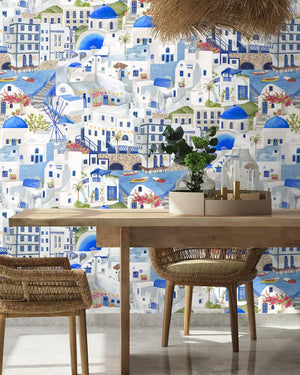 The Mediterranean wallpaper by Brand McKenzie in blue and white, a whitewashed hillside village in a dining area