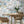 The Mediterranean wallpaper by Brand McKenzie in white and grey, a whitewashed hillside village in a dining area