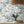 The Mediterranean wallpaper by Brand McKenzie in grey and blue, a whitewashed hillside village in a dining room