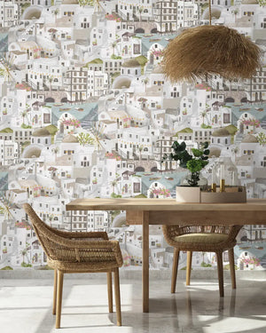 The Mediterranean wallpaper by Brand McKenzie in white, a whitewashed hillside village in a dining room
