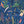The Tropics wallpaper by Brand McKenzie in blue, detail of tropical leaves and birds