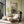 The Circus Big Top wallpaper by Annika Reed in green, big top stripes in a living room