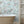 Tiger Lily wallpaper by Brand McKenzie in blue and pink, tigers among lilies in a bathroom