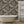 Tiger Lily wallpaper by Brand McKenzie in charcoal and gold, tigers among lilies in a bathroom