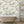 Tiger Lily wallpaper by Brand McKenzie in cream and green, tigers among lilies in a bathroom