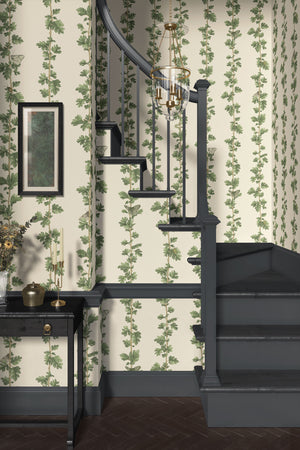 Hawthorn Stripe wallpaper by Studio Le Cocq in green, trailing hawthorn stripes in a bathroom