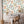 Travel Map wallpaper by Brand McKenzie in peach, an illustrated travel map above a work desk