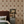 Sultana wallpaper by Deus ex Gardenia in gold, a vertical floral motif in a bedroom