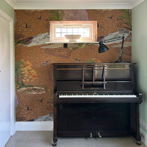 Up Hill Down Dale cork wallpaper by The Monkey Puzzle Tree in beige, a landscape on cork in a styled room setting