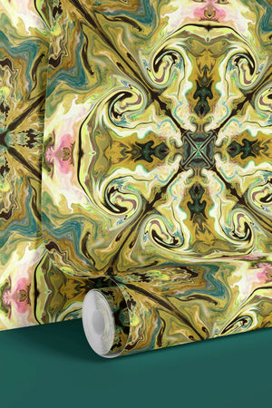 Versailles wallpaper by Liberty James Studio in green and gold, partly unrolled roll showing an ornate kaleidoscope design