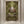 Versailles wallpaper by Liberty James Studio in green and gold, an ornate kaleidoscope design in a hallway