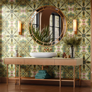 Versailles wallpaper by Liberty James Studio in green and gold, an ornate kaleidoscope design behind a desk in a home office