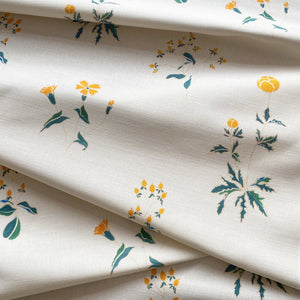 Victoria linen by Claire de Quénetain in green, draped, showing scattered flowers