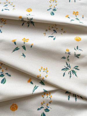 Victoria linen by Claire de Quénetain in green, draped, showing scattered flowers