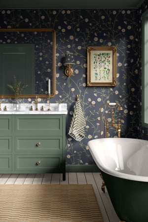 Daisy Chain wallpaper by Studio Le Cocq in navy, trailing daisy chains on a bathroom wall