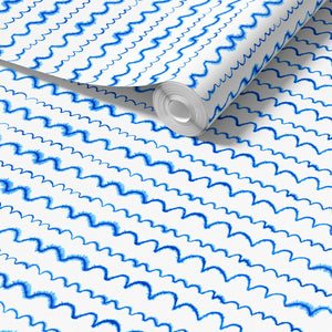 Wave After Wave wallpaper by Seed Home Designs in blue and white, roll showing wavy watercolour lines
