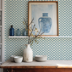 Wiggly Squiggly wallpaper by Annika Reed in teal and yellow, wiggly waves above a cabinet