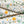 Adrienne linen by Claire de Quénetain in orange, draped, showing a hand-painted floral design