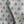 Agra linen by Annika Reed in blue, draped, showing block-print flowers in a trellis