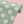 Aphrodite wallpaper by Annika Reed in green, sample roll showing scallop shells