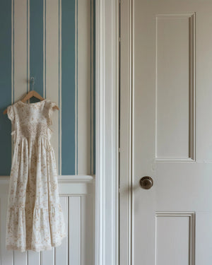 Balancing Act wallpaper by Annika Reed in blue, hand-painted stripes in an entryway
