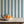 Balancing Act wallpaper by Annika Reed in blue, hand-painted stripes above a sideboard