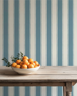 Balancing Act wallpaper by Annika Reed in blue, hand-painted stripes above a sideboard