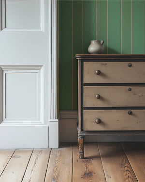 Balancing Act wallpaper by Annika Reed in green, hand-painted stripes in a hallway