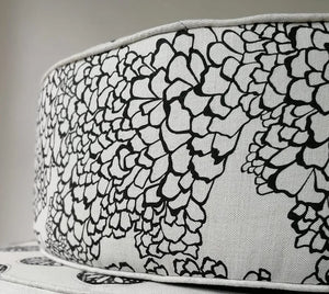 Bark linen by Bethie Tricks in black and white, organic bark shapes upholstered on an armchair