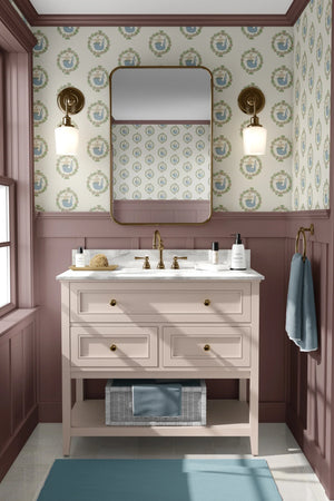 Mermaids in Seashore wallpaper by Annika Reed in cream and green, mermaids in wreaths in a bathroom