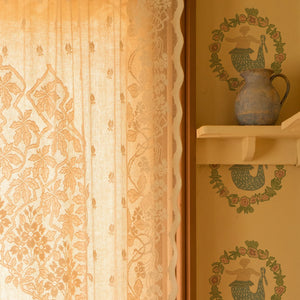 Mermaids in Seashore wallpaper by Annika Reed in gold, close-up of mermaids in wreaths