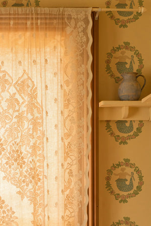 Mermaids in Seashore wallpaper by Annika Reed in gold, close-up of mermaids in wreaths