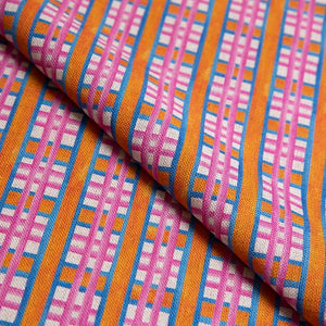 Beach Blanket linen by Bethie Tricks in pink and orange, draped, showing a bold check