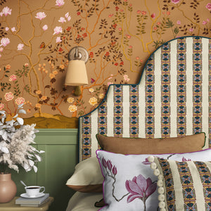 Eden Garden wallpaper by Dami and Em Design in orange, a chinoiserie garden in a styled room setting