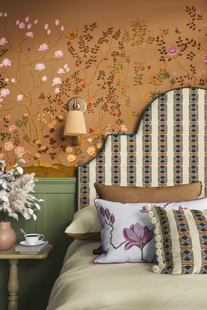 Eden Garden wallpaper by Dami and Em Design in orange, a chinoiserie garden in a styled room setting