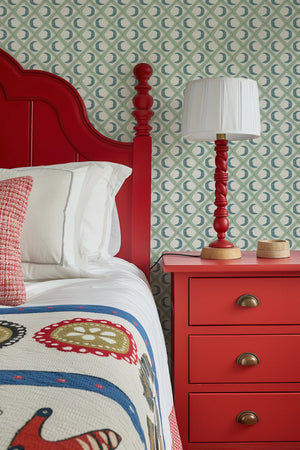Kit Moon wallpaper by Annika Reed in blue and green, crescent moons in a lattice in a bedroom