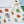 Beetle fabric by Seed Home Designs in red, blue and green, flat sample of watercolour beetles