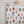 Beetle fabric by Seed Home Designs in red, blue and green, watercolour beetles on a feature wall