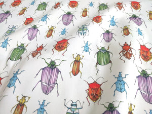 Beetle fabric by Seed Home Designs in red, blue and green, full repeat of watercolour beetles