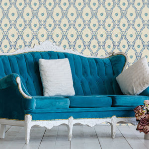 Belle wallpaper by Tatie Lou in blue, an ornate ogee trellis on a living room wall