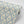 Belle wallpaper by Tatie Lou in blue, pattern sample of an ornate ogee trellis
