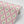 Belle wallpaper by Tatie Lou in pink, roll showing an ornate ogee trellis