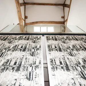 Between Certainty and Oblivion linen by The Monkey Puzzle Tree in black and white in a styled room setting