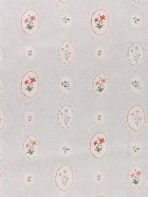 Bibury Sprig linen by Parker and Jules in pale blue, full repeat of embroidered flowers in ovals