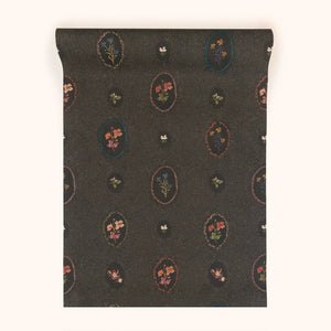 Bibury Sprig wallpaper by Parker and Jules in black, roll showing flower sprigs in ovals