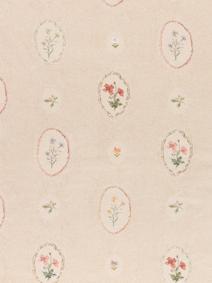 Bibury Sprig linen by Parker and Jules in beige, pattern sample of embroidered flowers in ovals