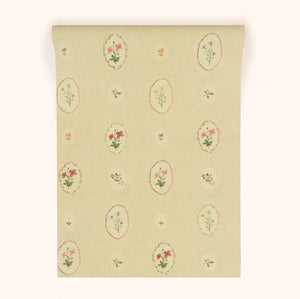Bibury Sprig wallpaper by Parker and Jules in beige, sample roll showing flower sprigs in ovals